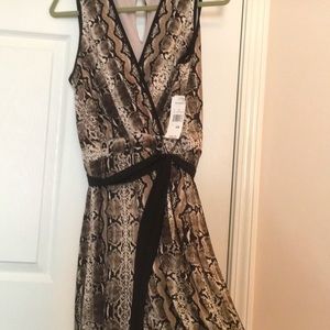 NWT Jumpsuit in stretch snake skin pattern, size 10, Sandra Darren.